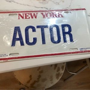 NWT actor New York license plate in plastic